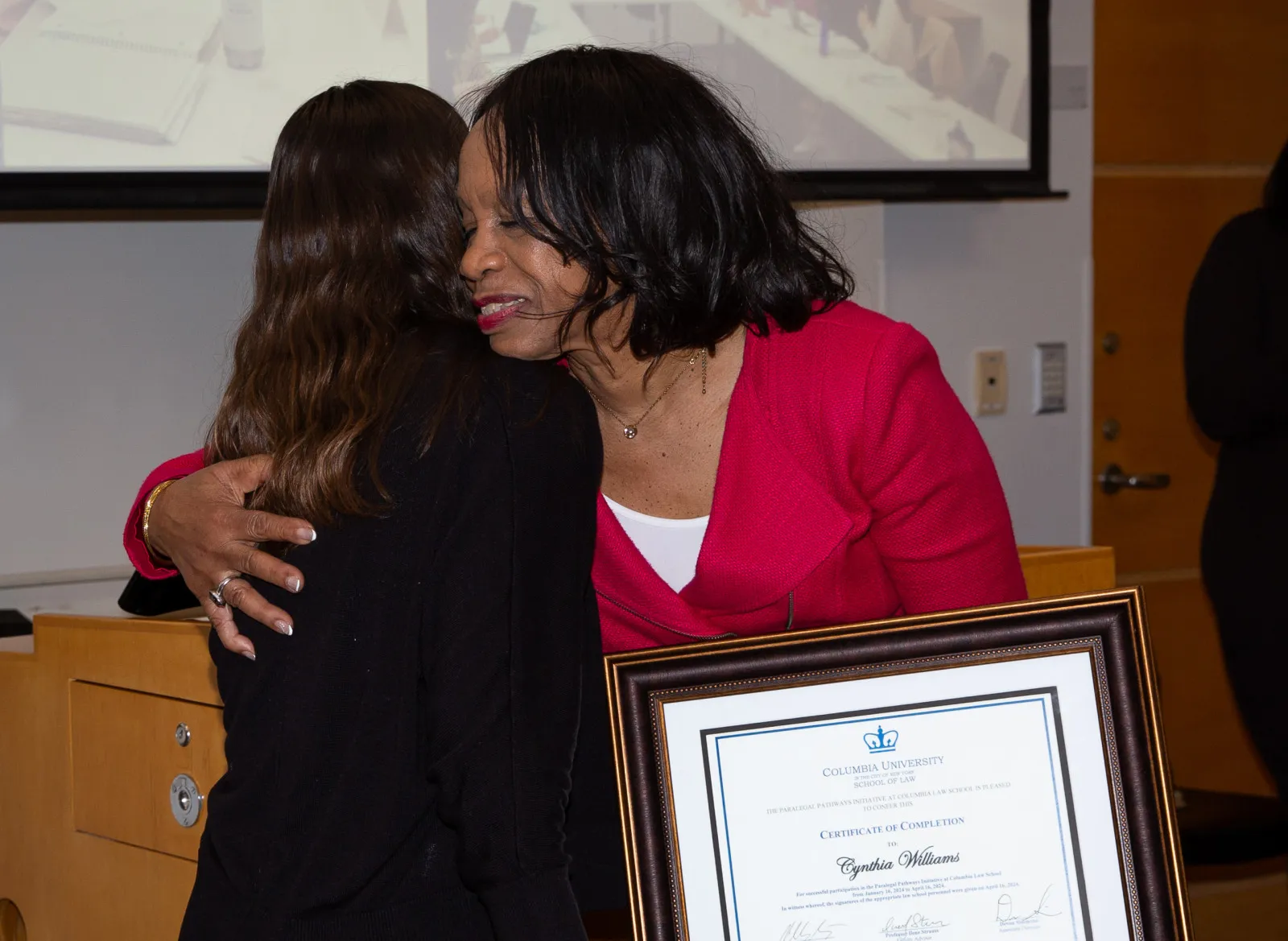 Cynthia Williams (PPI '24) receiving a graduation certificate.