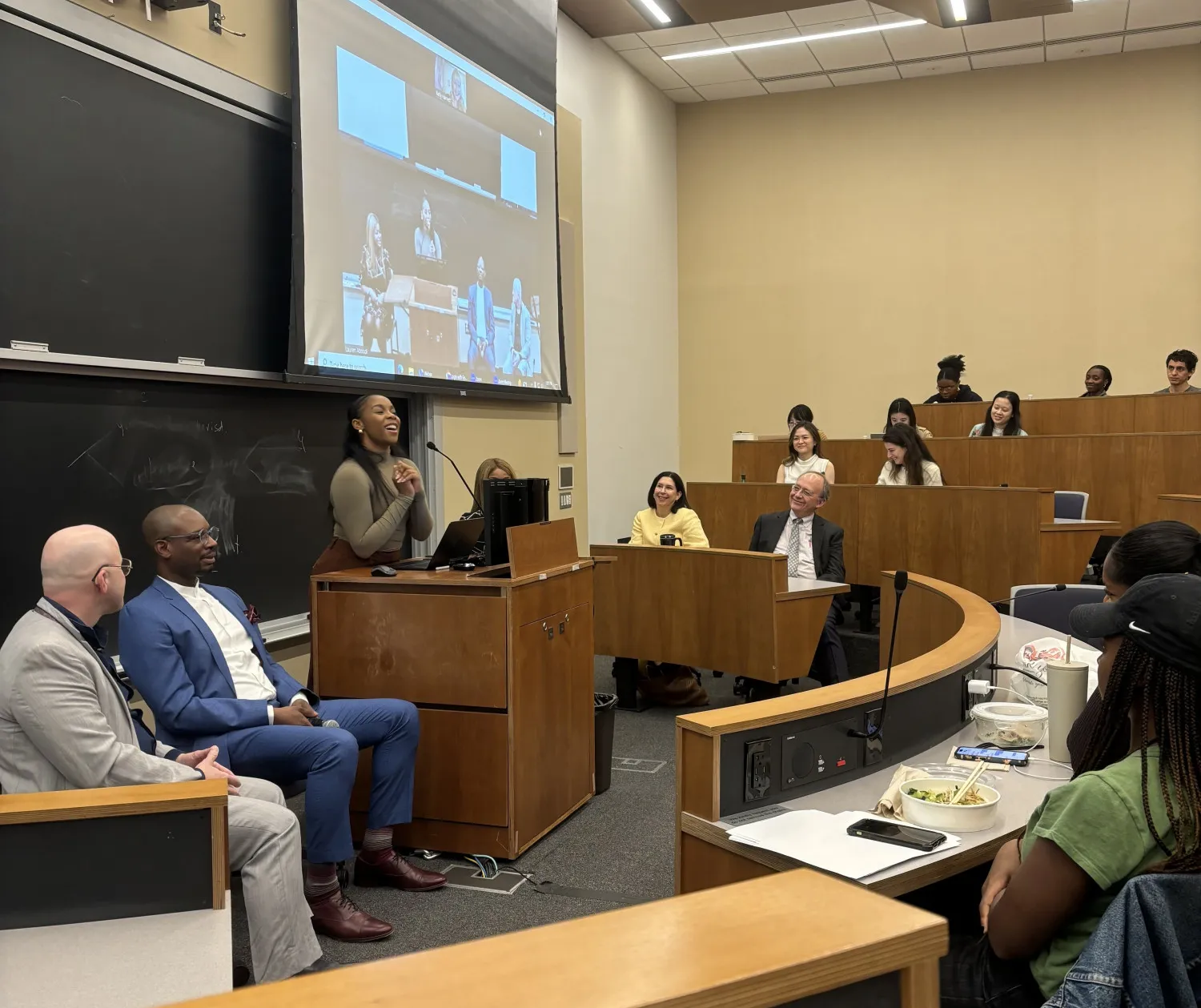 Photo of student moderating a panel discussion